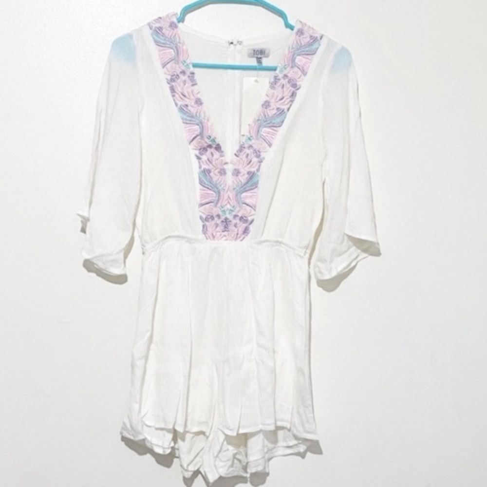 Tobi white romper with purple pastel embroidery v-neck